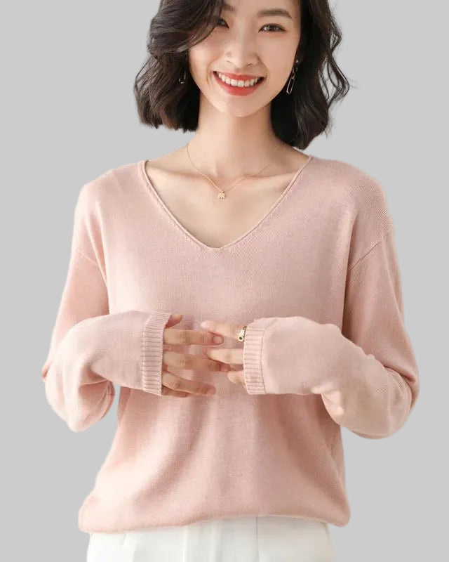 The V-neckline elongates the silhouette while the high-stretch knit ensures ease of movement, making it equally at home in the office or on a weekend escape. 