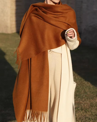 A faux cashmere thick wrap scarf featuring a soft, cozy texture and a generous drape for versatile, elegant warmth in cooler weather.