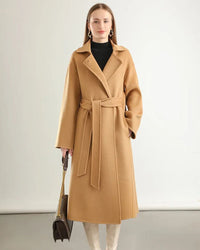 Woman city-strolling in the A-Line Pure Wool Belted Trench Coat, double-faced 19.5-micron Merino and small turn-down collar give heritage polish—your wind-proof 35-55 °F fall-through-spring commuter layer.