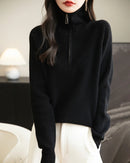 A merino wool quarter-zip sweater with quarter-zip neckline, stand collar and regular fit, designed for a cozy winter layering look that pairs from sneakers to boots.