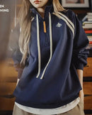 A quietly versatile pullover that softens the structure of a stand collar with a loose, easy fit.