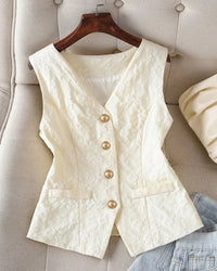 Textured polyester sleeveless vest with V-neck, gold button closure and tailored slim fit. Elegant and versatile — polished layering for office and casual wear.