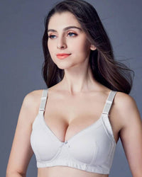 Woman lounging in the Zhangyan Plain-Weave Bra, feather-light cotton-ammonia fabric and wireless ¾-cup give invisible lift—your breathable 70-85 °F summer-to-fall essential that vanishes under backless tops .