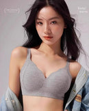 Rust-colored seamless thermal bra for fall–winter, brushed inside, fixed cups and no wires give soft support and gentle lift.