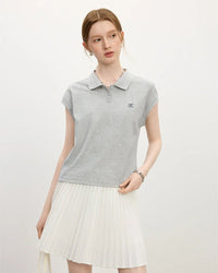 Woman strolling in a sand-beige breathable linen-blend tee, 52 % linen / 48 % TENCEL™ weave keeps you cool and dry—perfect lightweight staple for 70-85 °F summer days.