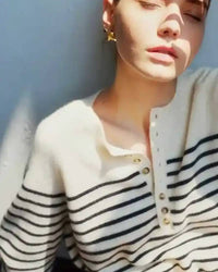 100 % wool striped pullover, contrast button detail at shoulder, relaxed fit, navy & cream—lightweight warmth for winter layering or solo wear.