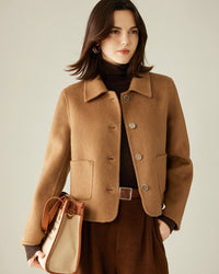 Women’s camel-hair & cashmere coat in classic Chanel beige,  double-breasted four-button front, notch collar with delicate top-stitching, 80 % camel hair 20 % cashmere, soft brushed finish, office-to-evening elegance.