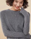 Women’s cashmere round-neck pullover with relaxed long sleeves and loose drape—cloud-soft staple for office blazers, weekend cabin escapes or fireside lounging.