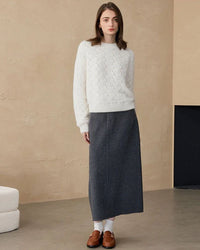 Soft-white crew-neck cashmere pullover featuring airy hollow stitches and a plush 2.8 mm knit, ideal for cold-weather commutes or weekend coffee runs.