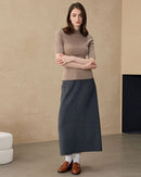 Three-quarter sleeve jumper in soft oat cashmere, ribbed funnel and slim silhouette work as both office blouse and cozy inner sweater.