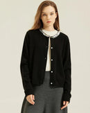 Soft cashmere cardigan jacket in pale gold with allover sequin shimmer, slim silhouette keeps you warm and elegant through winter celebrations.