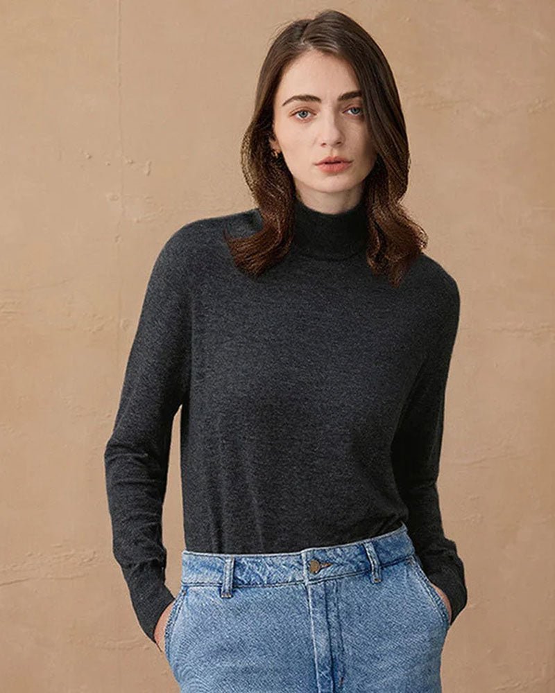 Soft cashmere-wool jumper with a relaxed mock neck and ribbed cuffs, perfect for keeping warm on morning commutes without the bulk of a full turtleneck.