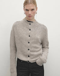 Women’s half-turtleneck cardigan with single-breasted front and slim long sleeves—sleek thermal layer for autumn offices, weekend cafés or travel-day chic.