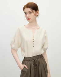 Women's apricot minimalist loose short-sleeved shirt featuring a small V-neck and slim sleeves, perfect for casual summer  fashion and everyday comfort.