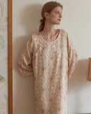 Woman drifting off in a Chinese-style retro-flower-print sleepdress, airy cotton gauze keeps you cool—your breathable, vintage-inspired staple for 70-85 °F summer nights.