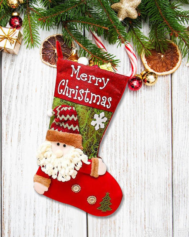 Reusable burlap Christmas candy pouches printed with reindeer and Santa motifs, eco-friendly packaging for festive treats.