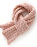 Woman looping the Classic Cable-Knit Cashmere Short Scarf, 19-micron 100 % cashmere and honey-comb cables give cloud-soft warmth—your luxe yet breathable 35-55 °F fall-through-spring wrap that doubles as a neck-warmer on flights.