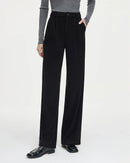 Woman heading to work in commuter straight-knitted pants, fine-gauge viscose-wool blend drapes like jersey—your polished yet cozy 65-75 °F spring-fall commuter layer.