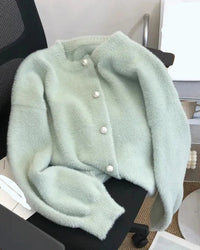 Women’s imitation-mink-velvet cardigan with O-neck pearl-button front and relaxed long sleeves—soft statement layer for autumn cafés, weekend movies or layered street looks.