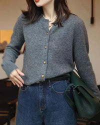 Woman brunching in a Crewneck 100 % Cashmere Short Cardigan, 19-micron Mongolian fibers and boxy cropped cut hit just above high-rise jeans—your luxe yet breathable 60-75 °F spring-fall statement.