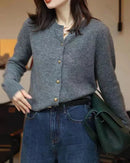 Woman brunching in a Crewneck  Cashmere Short Cardigan, 19-micron Mongolian fibers and boxy cropped cut hit just above high-rise jeans—your luxe yet breathable 60-75 °F spring-fall statement.