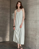 Women's elegant linen backless dress – sleeveless strap design, loose casual fit, perfect for summer holidays, beach getaways, and trendy streetwear styling.