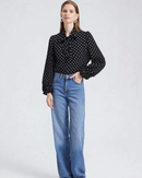Elegant plus size women's polka dot long sleeve shirt featuring charming bow collar and single breasted closure, classic black white spotted blouse with puffed sleeves perfect for office and weekend chic.