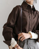 Women's loose long-sleeve button shirt, featuring cotton-polyester blend broadcloth and a turn-down collar for Korean OL style from office desk to weekend brunch.