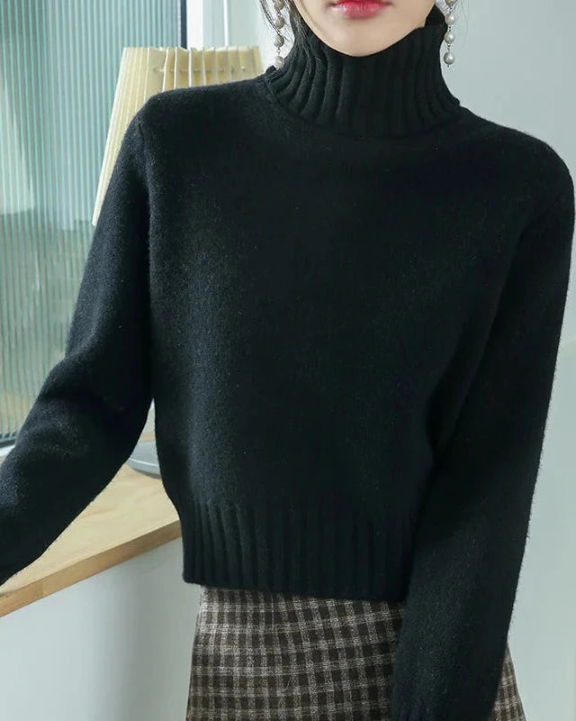Minimal in form yet rich in texture, this turtleneck knit offers a sleek approach to cold weather dressing. 