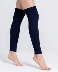 A pair of knit cotton blend leg warmers with a 3D stretch wrap, designed for a secure fit that stays put under boots and skirts all day.