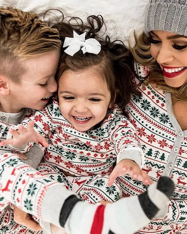Gray Family matching Christmas pajamas set featuring a festive Nordic pattern with red reindeer, green Christmas trees, and snowflakes. This unisex sleepwear set is made from a soft 65% cotton and 35% polyester blend and includes long-sleeved tops and pants for mom, dad, and kids.