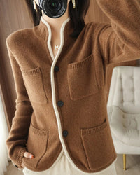A cashmere stand collar cardigan with a single-breasted front and loose fit, designed for soft, warm layering in autumn and winter.