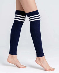 A pair of striped knit cotton blend leg warmers with a 3D stretch wrap, designed for a secure fit that stays put under boots and skirts all day.