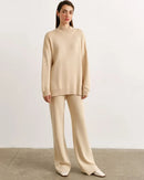 Woman lounging in a Half-Turtleneck Sweater & Wide-Leg Pants Knitted Suit, 55 % wool / 45 % viscose rib drapes like jersey—your cozy yet polished 60-75 °F spring-fall layer.