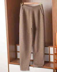 High-rise cashmere Harlan pants, relaxed tapered leg and ribbed cuffs, soft dove-gray—winter luxe loungewear for her.