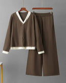 Woman brunching in a Long-Sleeve V-Neck Sweater & Wide-Legs Pants set, airy 55 % wool / 45 % viscose rib drapes like jersey—your cozy yet polished 60-75 °F spring-fall statement.