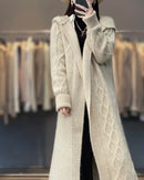 Women's merino-wool long cardigan with twisted texture and loose coat silhouette—statement layer for autumn offices, winter weekends or travel days.