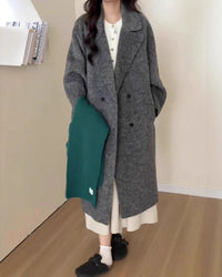 Flat-lay of slate-gray maxi overcoat, reversible brushed wool offers two clean finishes—belt it for cinched elegance or wear open for relaxed polish.