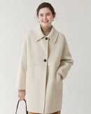 Soft wool double-faced coat with tailored lapel, relaxed fit and polished details. Versatile for cooler seasons—understated luxury from Gentle Herd.
