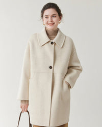 Soft wool double-faced coat with tailored lapel, relaxed fit and polished details. Versatile for cooler seasons—understated luxury from Gentle Herd.
