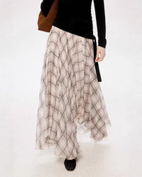 Women's beige irregular plaid skirt featuring an asymmetrical hem design and a timeless check pattern, perfect for spring and casual daily wear.