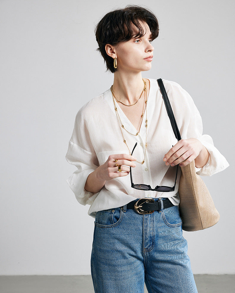 Women's ramie long-sleeve shirt featuring a solid color V-neck design and a comfortable loose fit, perfect for spring and summer fashion.