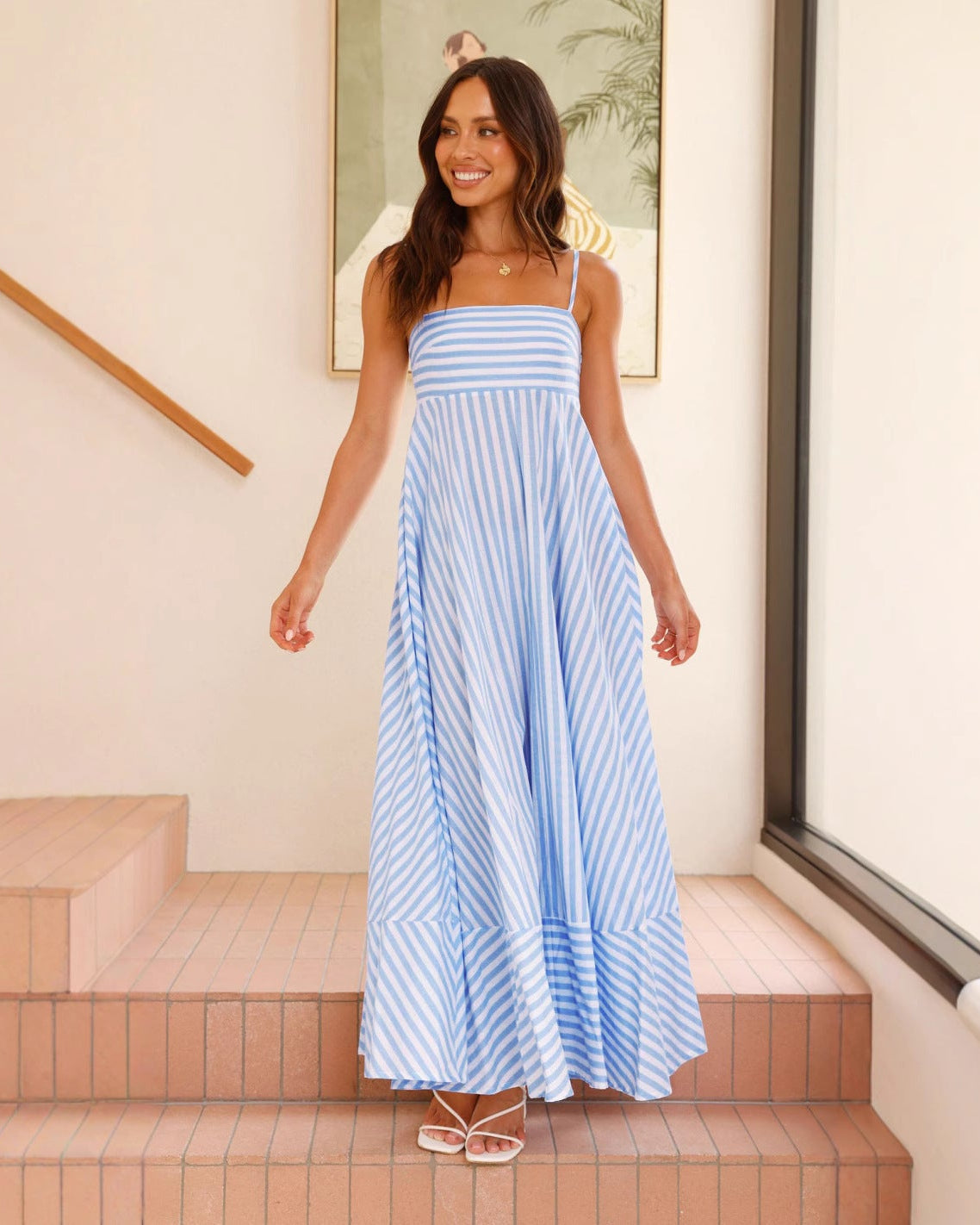 Discover our lightweight striped maxi dress with square neck, spaghetti straps, and ruffled hem.
