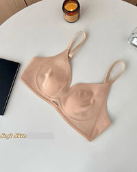 Seamless wireless bra with front cutout detail and adjustable thin straps. Breathable contoured cup intimates for invisible everyday layering.