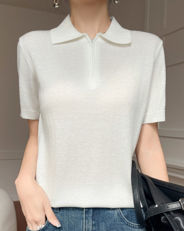 Stylish women's short-sleeve knit sweater made of premium worsted wool featuring a modern front zipper lapel detail and a slim fit silhouette.