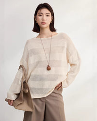 Apricot loose fitting striped slightly sheer knit t shirt crafted from a breathable silk rayon blend, featuring a delicate open weave texture and rolled boat neck, perfect for spring layering, 