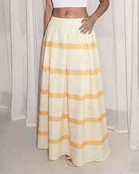 Elevate your warm-weather wardrobe with our striped elastic waist maxi skirt.