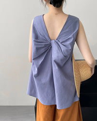 Loose sleeveless back knotted vest for women, crafted from soft breathable fabric, featuring a relaxed silhouette and a unique knotted back detail, perfect for spring and summer minimalism.