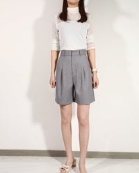 levate your warm-weather wardrobe with our high waist pleated bermuda shorts.