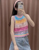 Women's rainbow striped acrylic knitted vest with a round O-neck and hollow-out knit pattern. This loose-fit, sleeveless pullover in a straight silhouette offers a lightweight layering option for spring and summer.